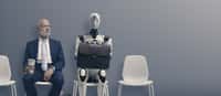 Un homme et un robot dans une salle d’attente en vue d’une interview d’embauche. Certains se demandent s’il y aurait là l’anticipation d’un futur où l’IA en viendrait à menacer nos emplois. © stokkete, Adobe Stock